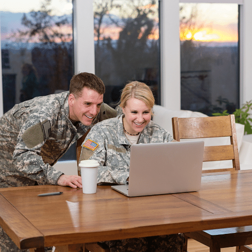 military-couple-laptop-home
